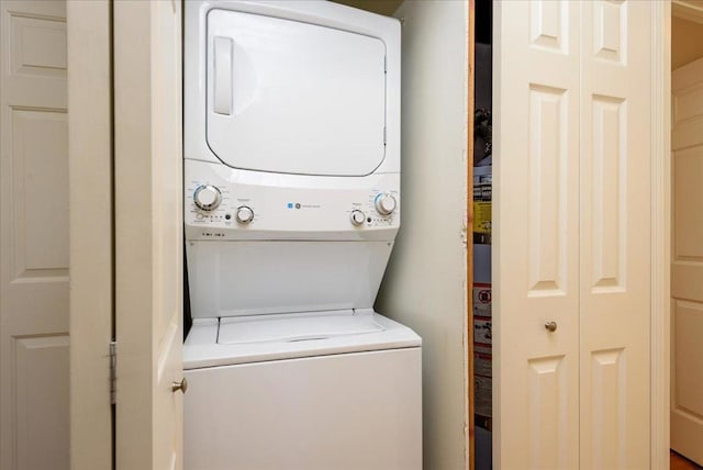 laundry room featuring stacked washer and clothes dryer