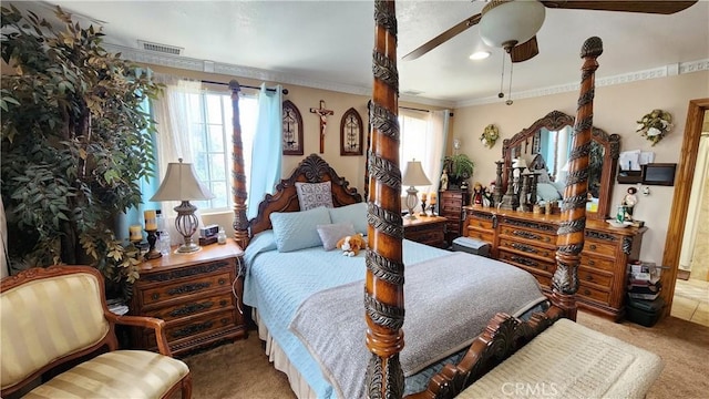 carpeted bedroom with ceiling fan and crown molding