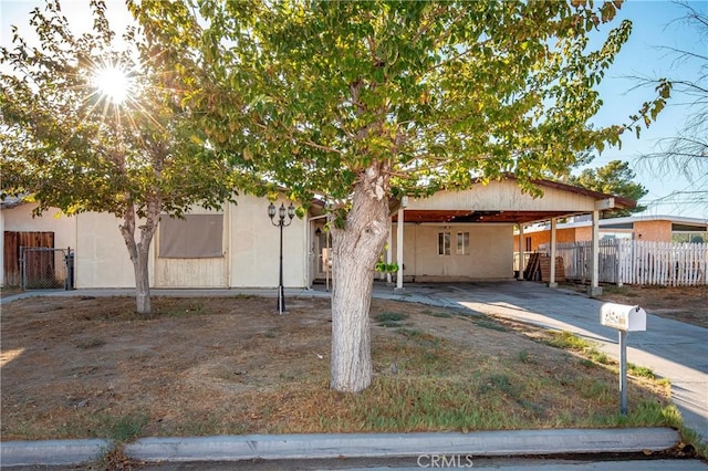 view of front of home with a carport