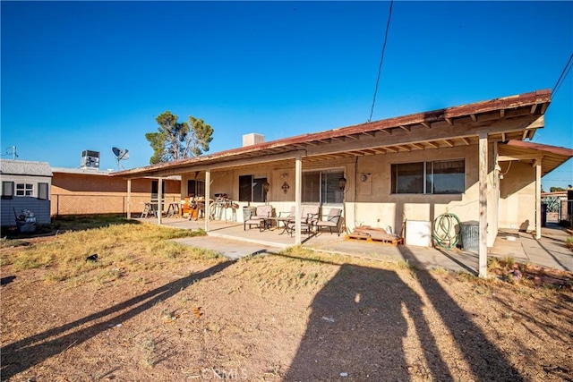 rear view of property with a patio