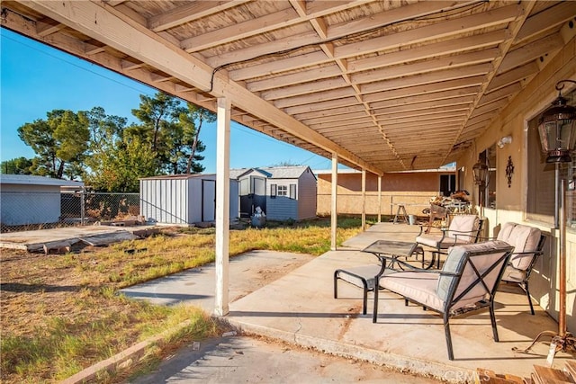 view of patio / terrace featuring a storage unit