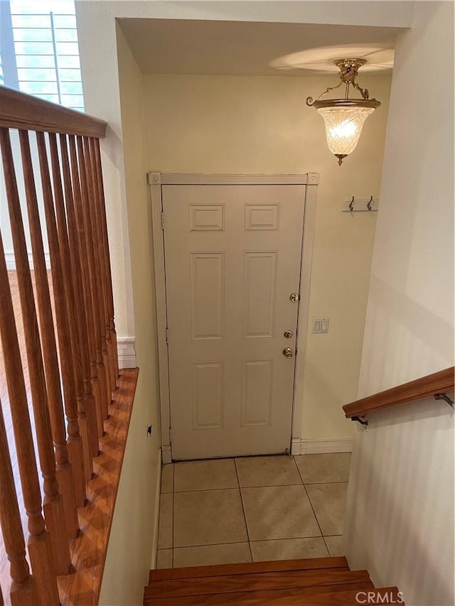 doorway featuring light tile patterned floors