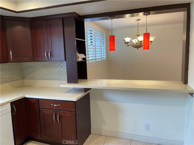 kitchen with dishwasher, light tile patterned floors, tasteful backsplash, decorative light fixtures, and a chandelier