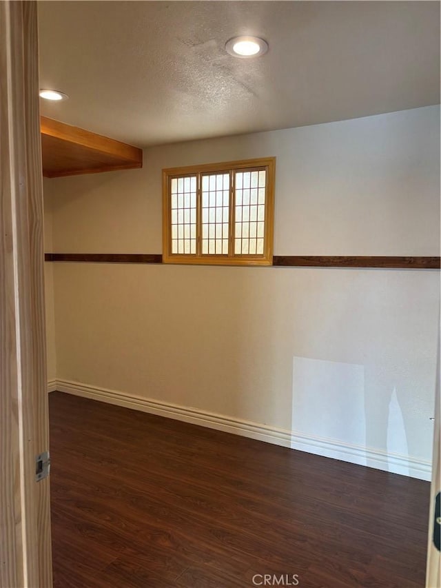 unfurnished room featuring dark hardwood / wood-style floors