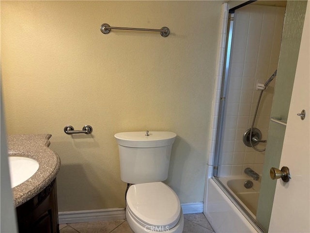 full bathroom featuring toilet, tile patterned flooring, vanity, and combined bath / shower with glass door