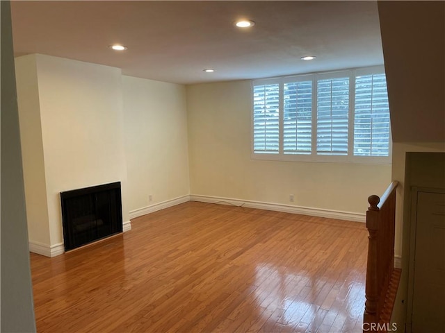 unfurnished living room with light hardwood / wood-style flooring