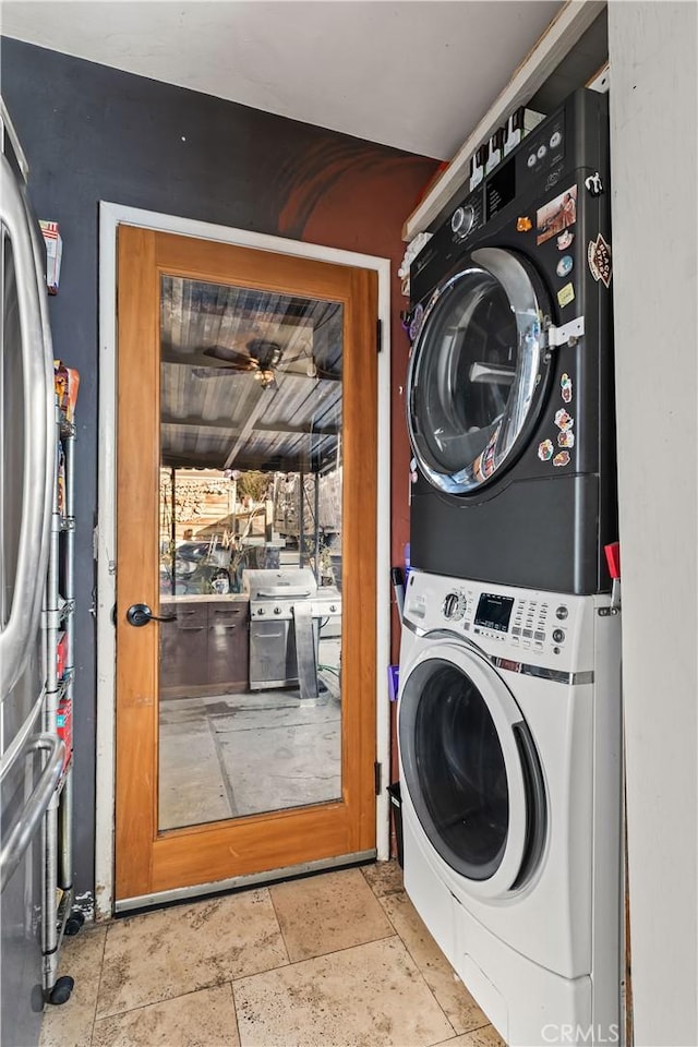 laundry room with stacked washing maching and dryer