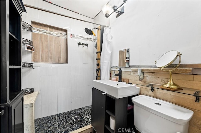 bathroom with vanity, toilet, and walk in shower