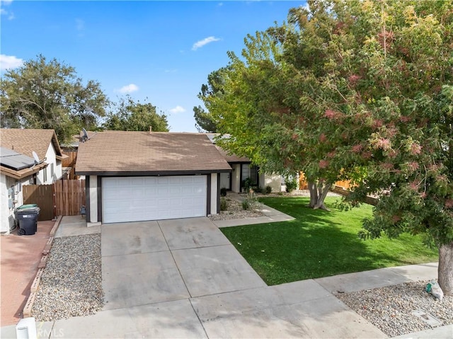 view of front of house with a garage and a front yard