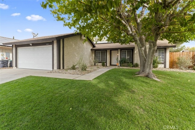 single story home featuring a garage and a front lawn