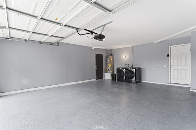 garage with washing machine and clothes dryer, strapped water heater, and a garage door opener