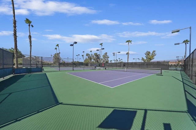 view of sport court with basketball hoop