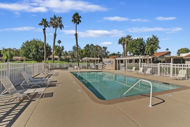 view of swimming pool featuring a pergola and a patio