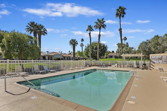 view of pool with a pergola and a patio