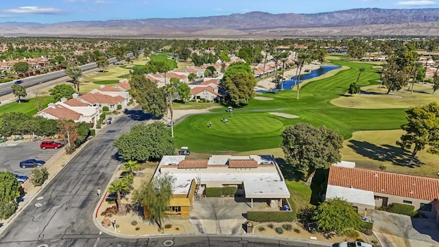 birds eye view of property with a mountain view