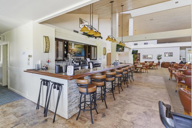 bar with hanging light fixtures