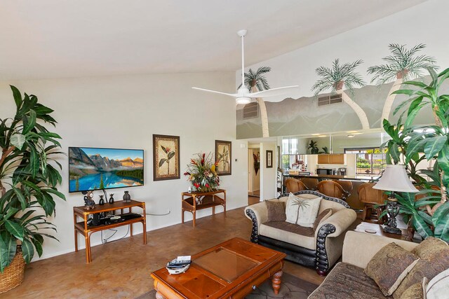 living room featuring vaulted ceiling and ceiling fan