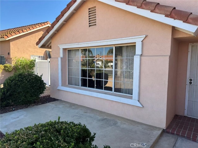 view of property exterior featuring a patio