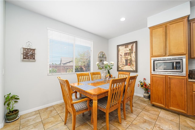 dining area with light tile patterned flooring