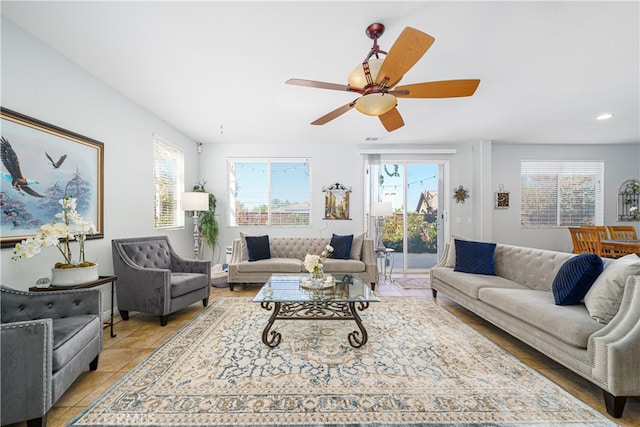 tiled living room with ceiling fan