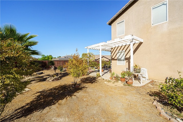 view of yard with a patio area and a pergola