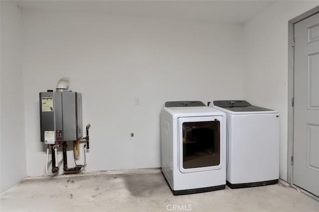 washroom with independent washer and dryer and water heater