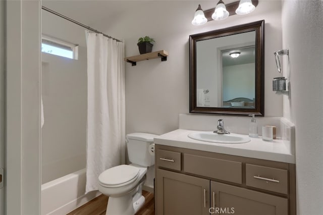 full bathroom featuring vanity, toilet, shower / bathtub combination with curtain, and hardwood / wood-style floors