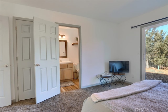 carpeted bedroom with ensuite bathroom