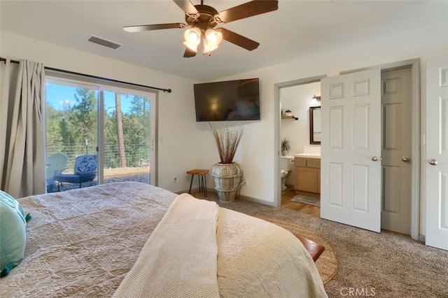 bedroom with ensuite bathroom, access to outside, light colored carpet, and ceiling fan