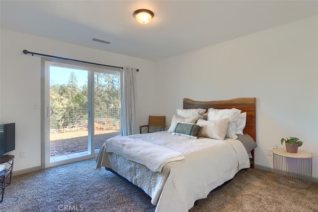 bedroom with carpet floors and access to exterior