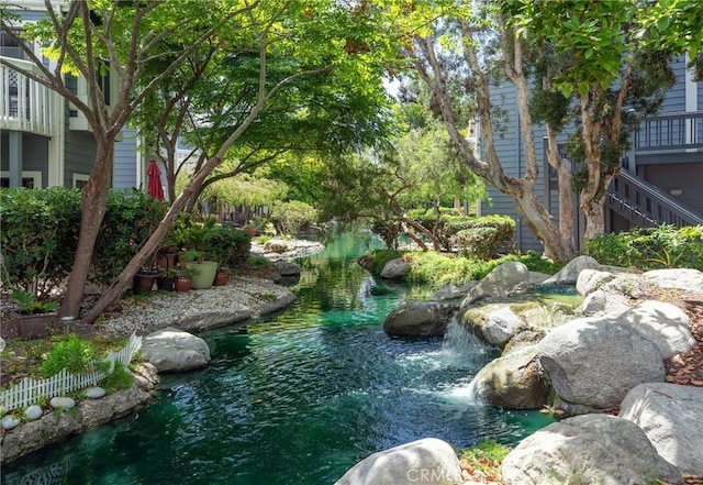 view of yard with a small pond