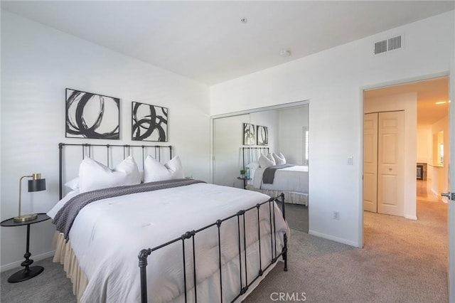 bedroom featuring light carpet and a closet