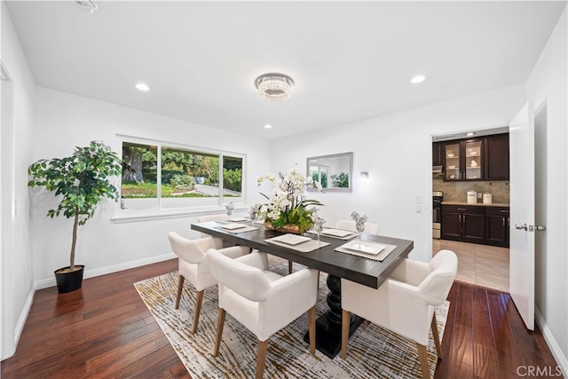 dining space featuring dark wood-type flooring