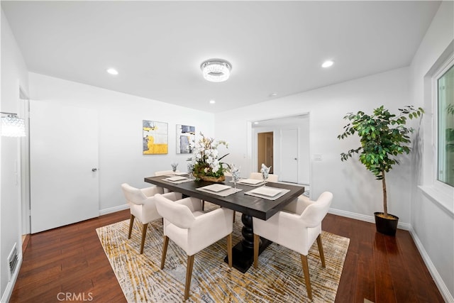 dining area with dark wood-type flooring