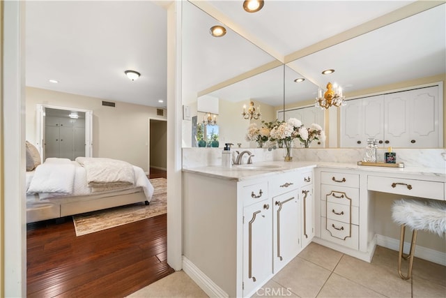 bathroom featuring hardwood / wood-style floors and vanity