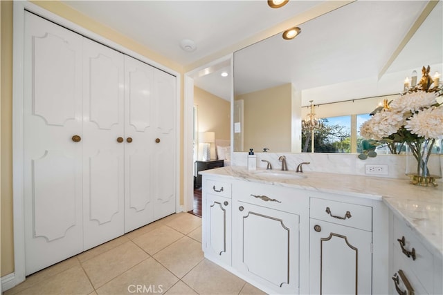 bathroom with tile patterned flooring and vanity