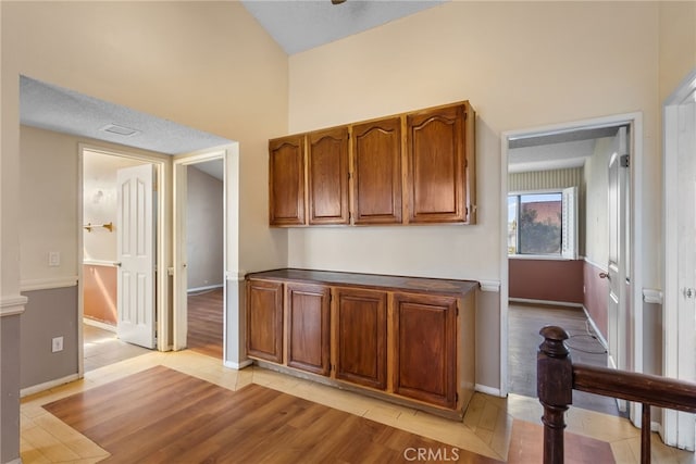 kitchen featuring light hardwood / wood-style flooring and a textured ceiling