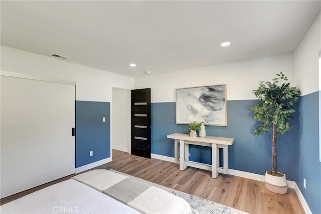 bedroom with hardwood / wood-style floors