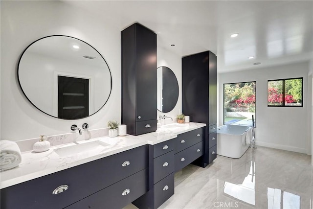 bathroom with vanity and a bathing tub