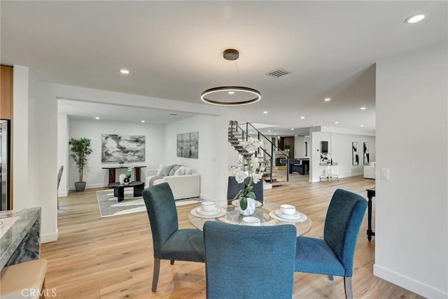 dining area with light wood-type flooring