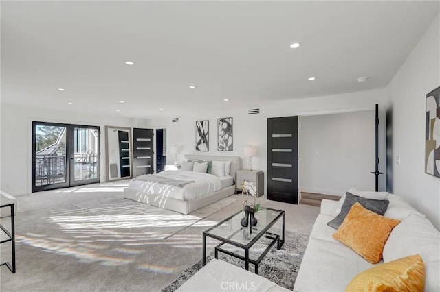 bedroom with light carpet, access to outside, and french doors