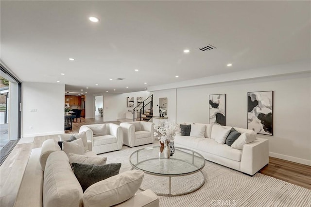 living room with light hardwood / wood-style flooring