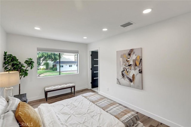 bedroom with wood-type flooring