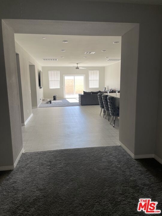 interior space featuring ceiling fan