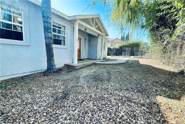 view of property exterior featuring a patio