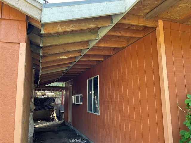 view of home's exterior featuring a wall mounted air conditioner