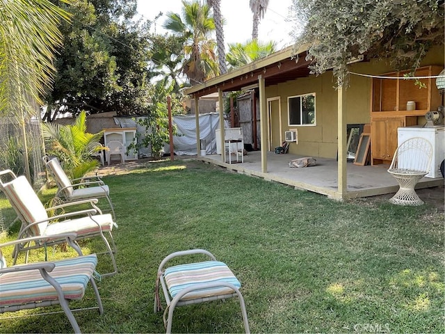 view of yard featuring washer / clothes dryer and a patio area