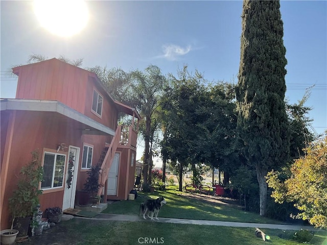 view of home's exterior featuring a lawn