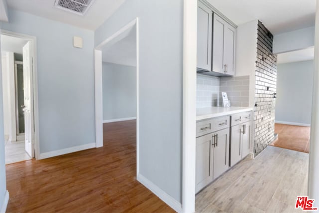 hall with light hardwood / wood-style floors