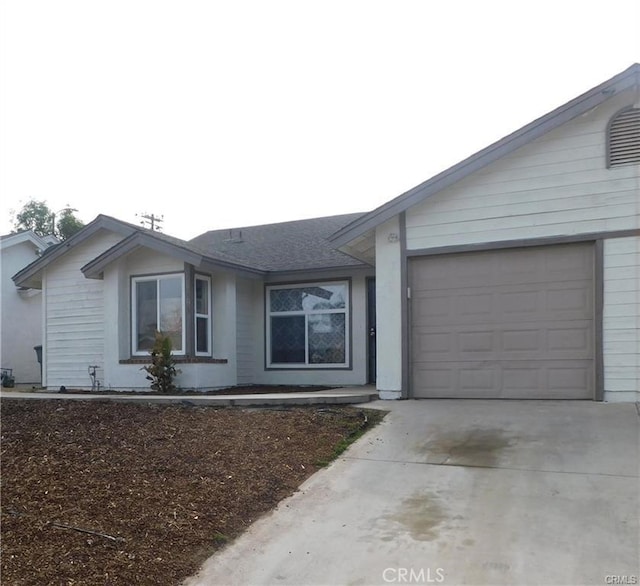 single story home featuring a garage